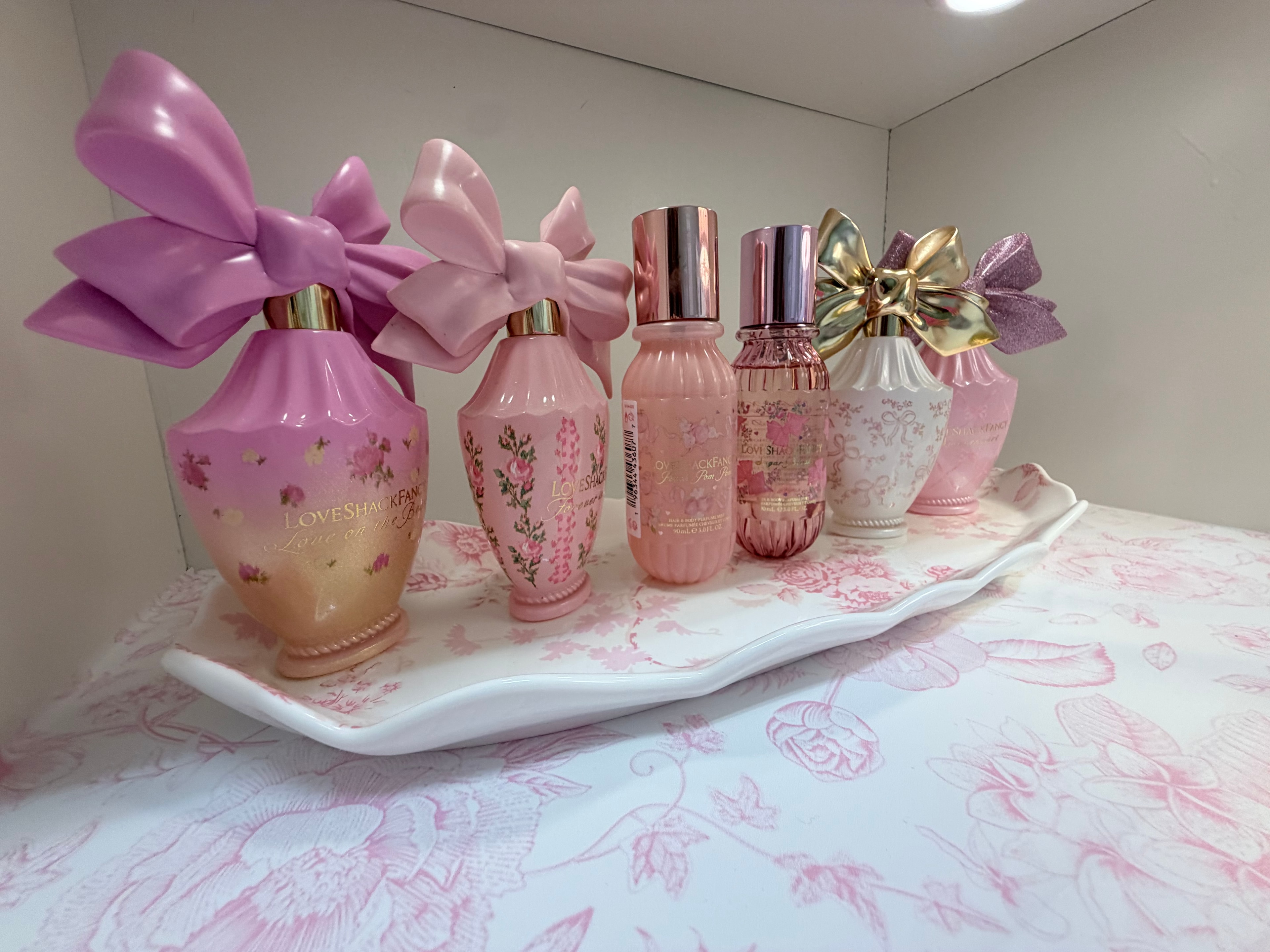 LoveShackFancy perfume bottles on tray