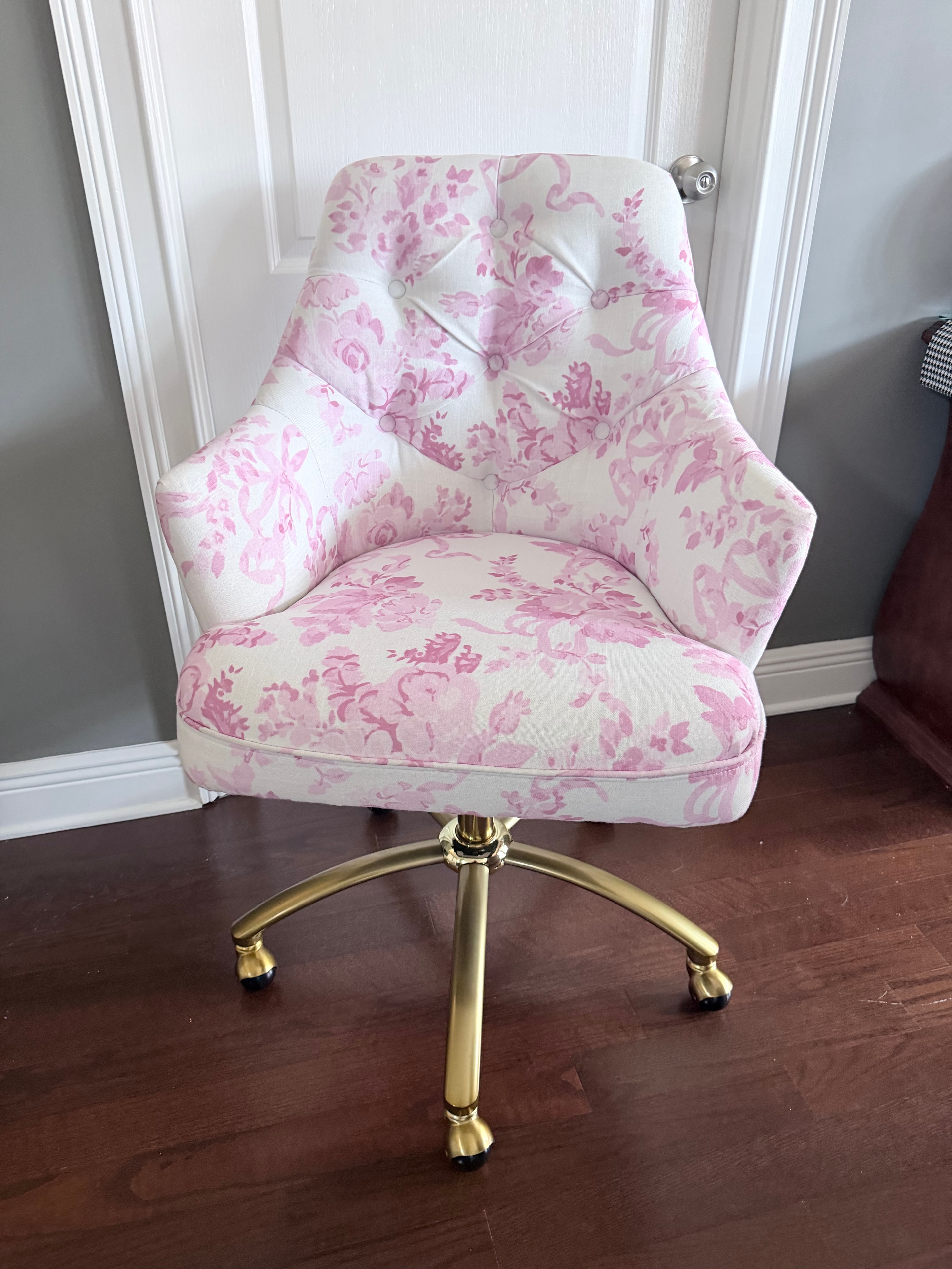Pink floral tufted vanity stool with gold brass legs