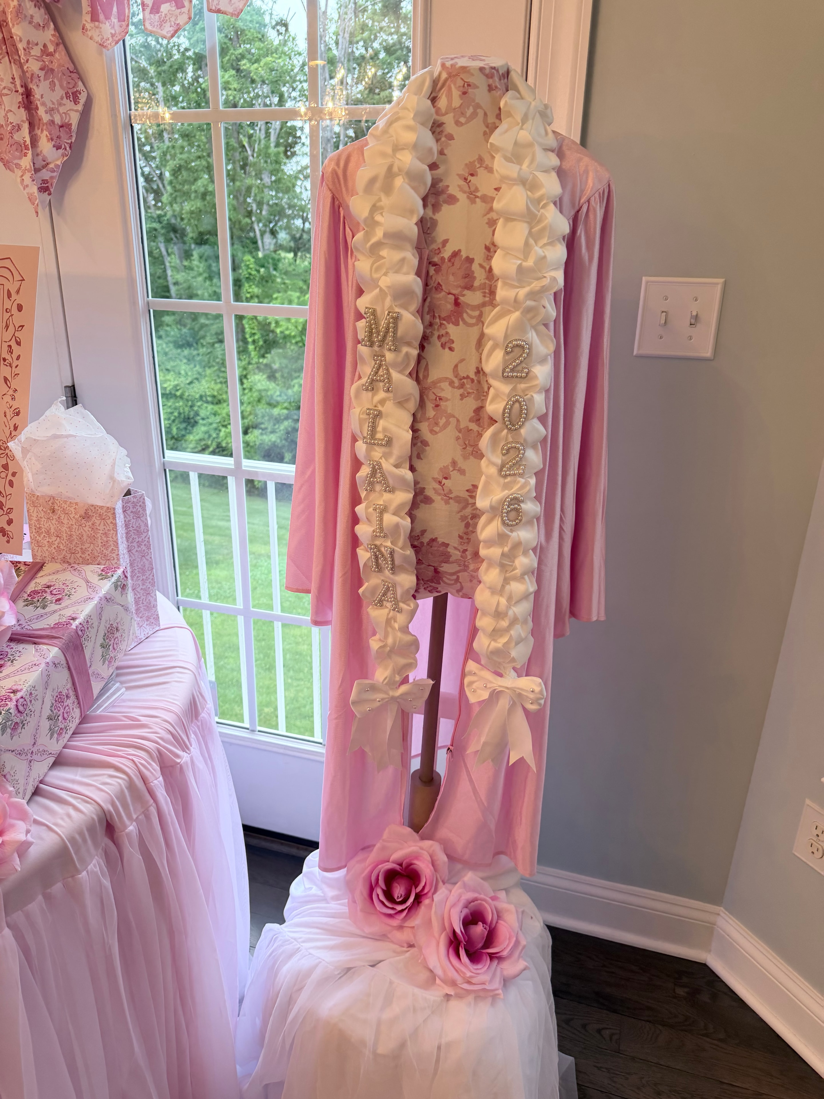 Dress form with ruffles and Malaina 2025 lettering